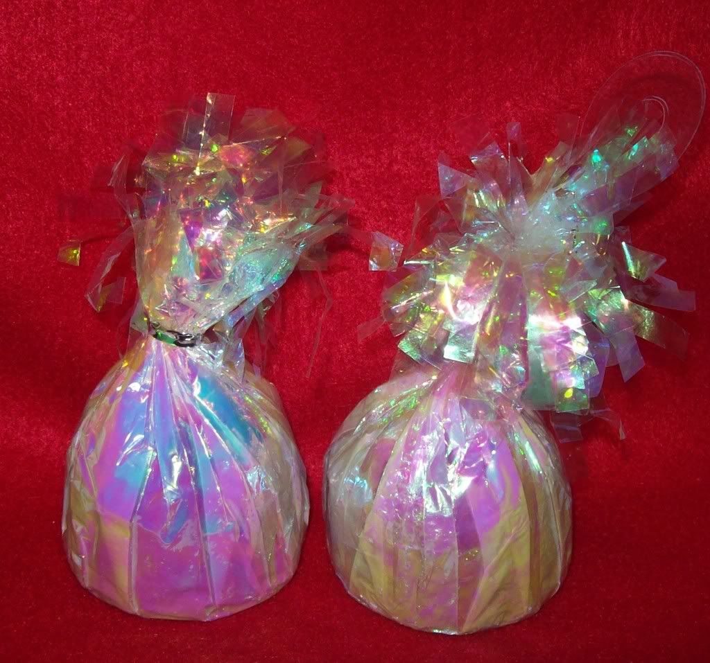 2 White Irredescent Balloon Weights. These Can Be Used To Hold Down